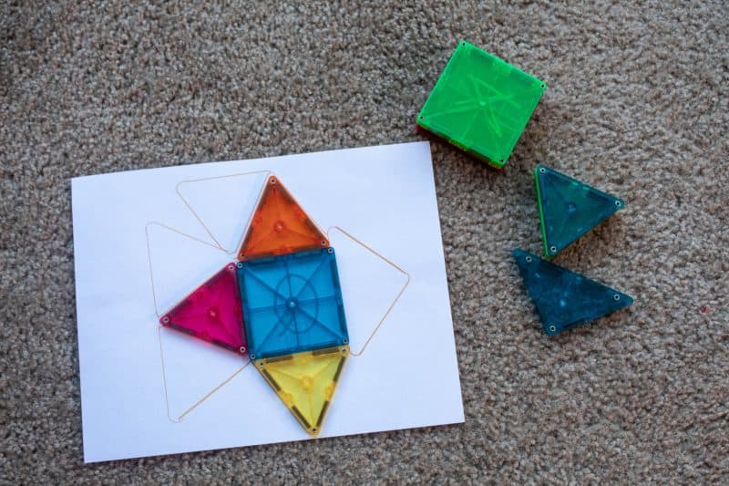 Magnetic tile activity. Match the shapes to the flat design drawn on a piece of paper.