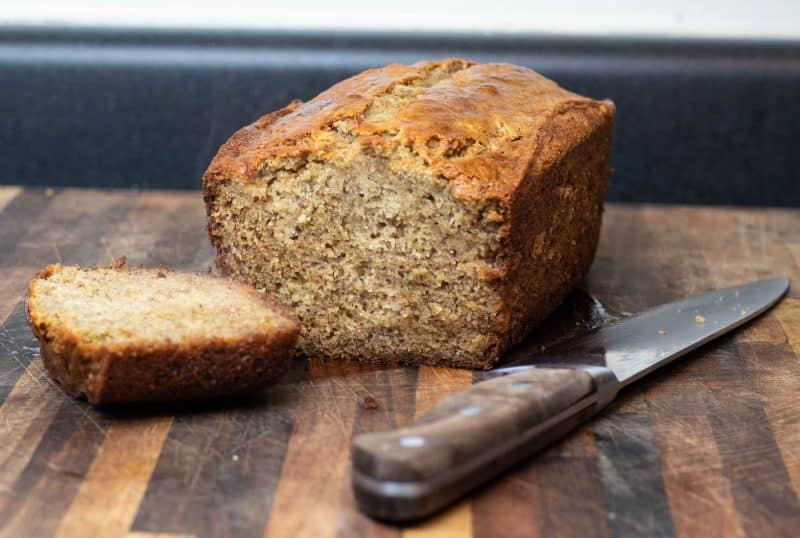 Sourdough Banana Bread loaf with a slice cut.