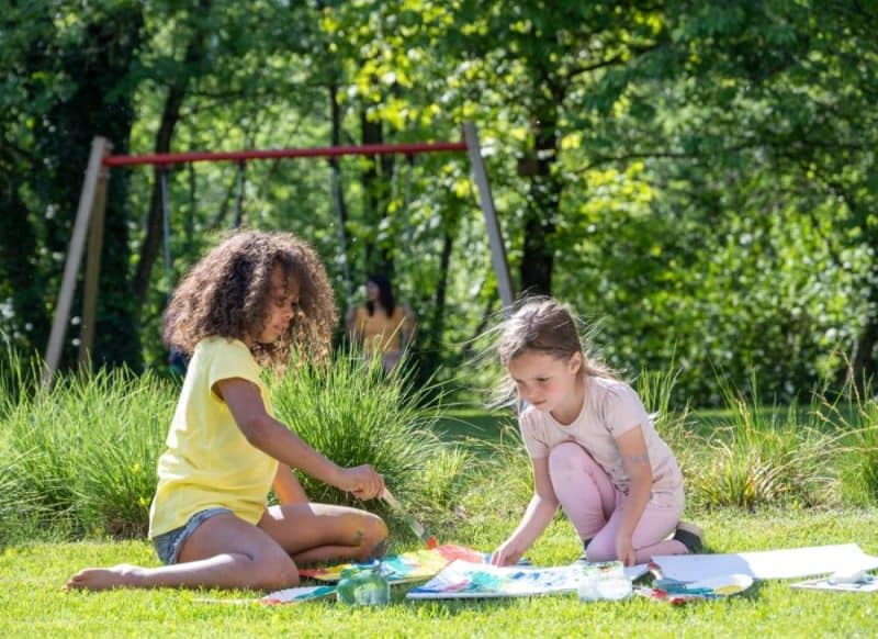 Kids painting outside at a park